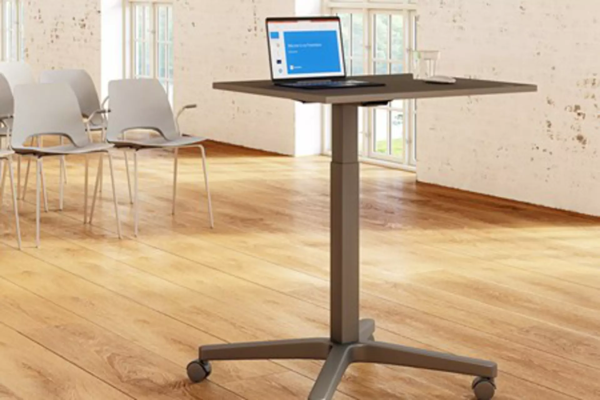 Movable presenter and lecturer desk with a single electric lifting column for easy adjustment and improved ergonomics.