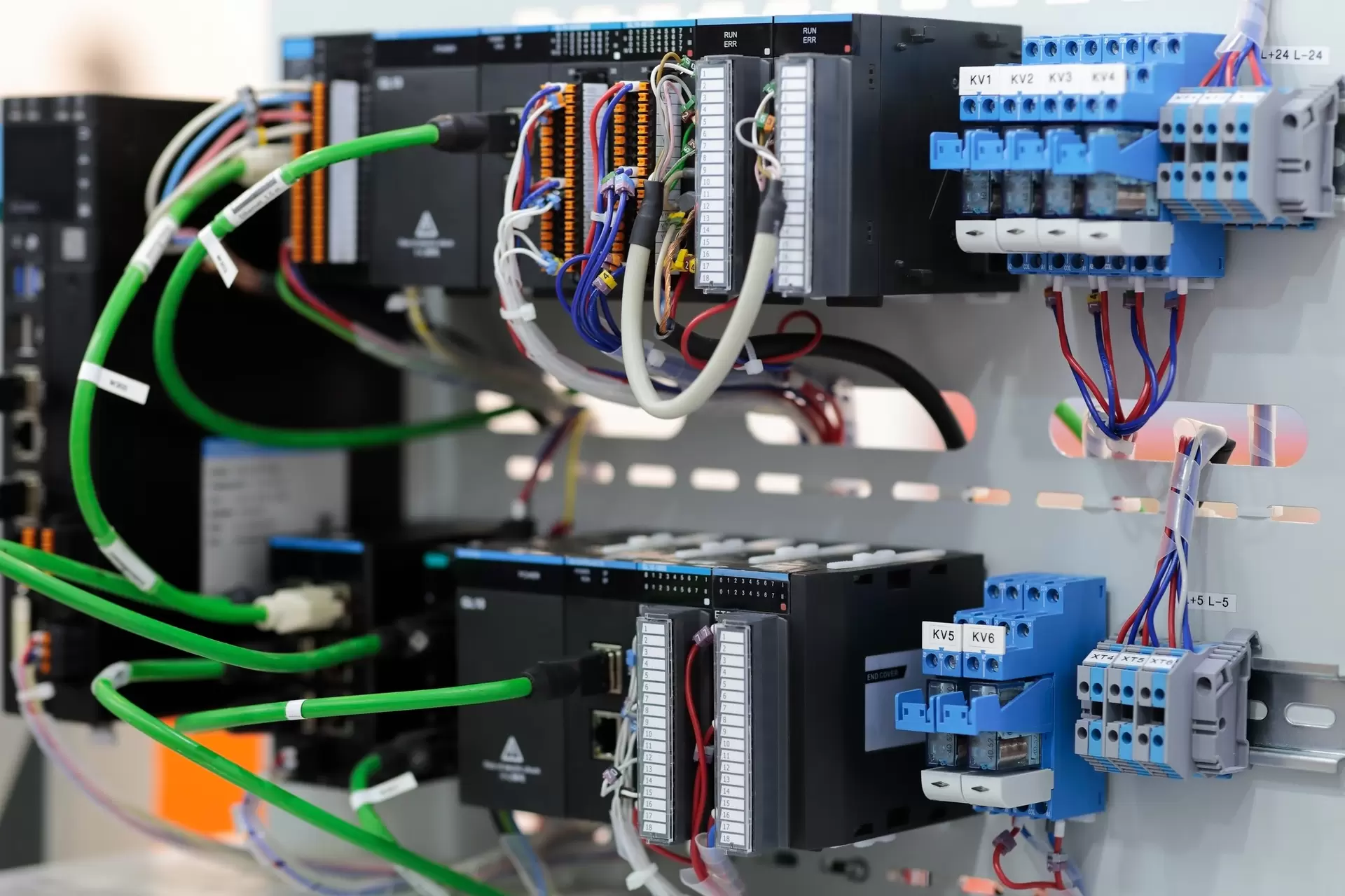 Automation control cabinet with PLC and I/O modules for actuator integration