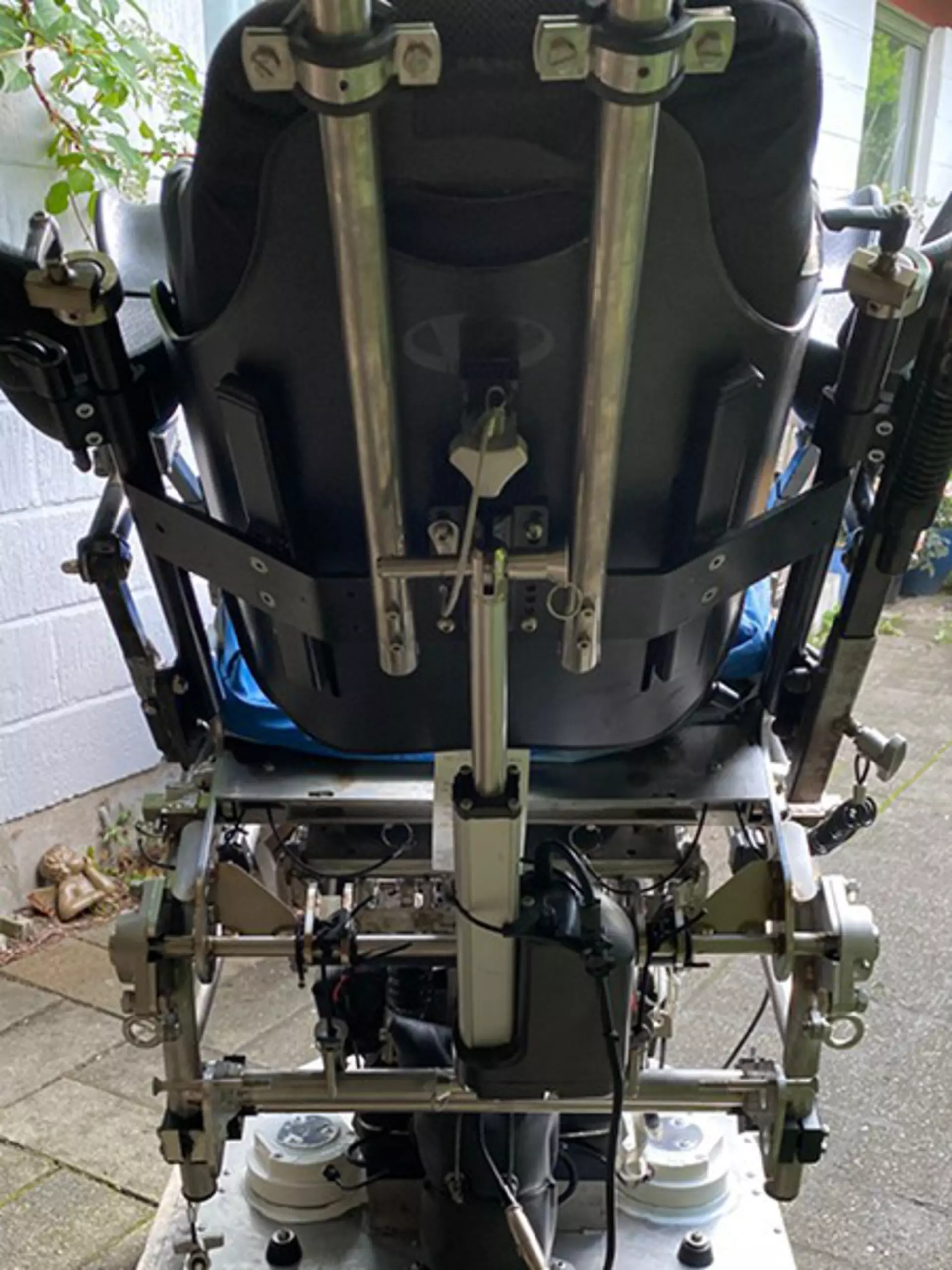 The backside of the wheelchair console with actuator adjustment.
