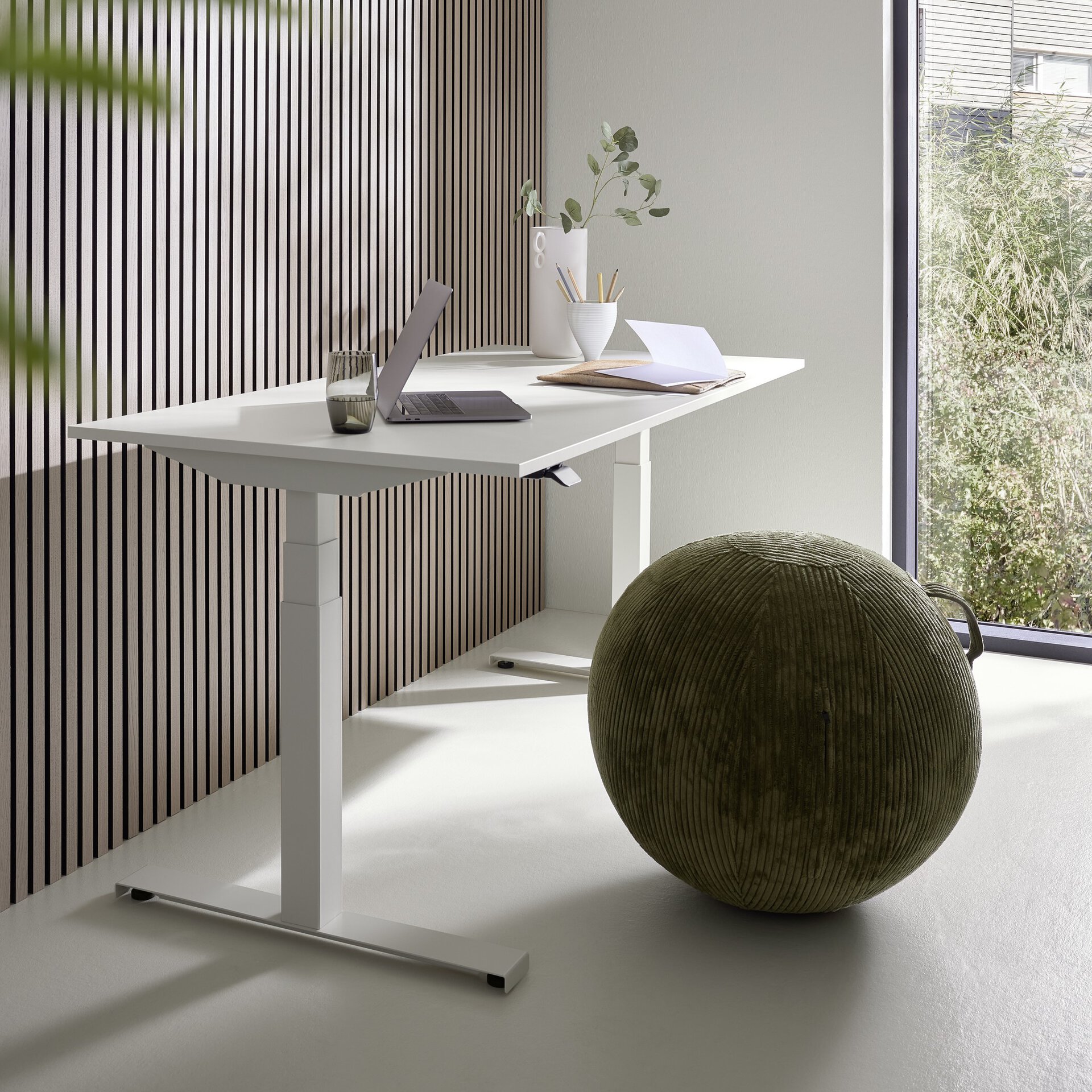 White lifting column built into an office desk