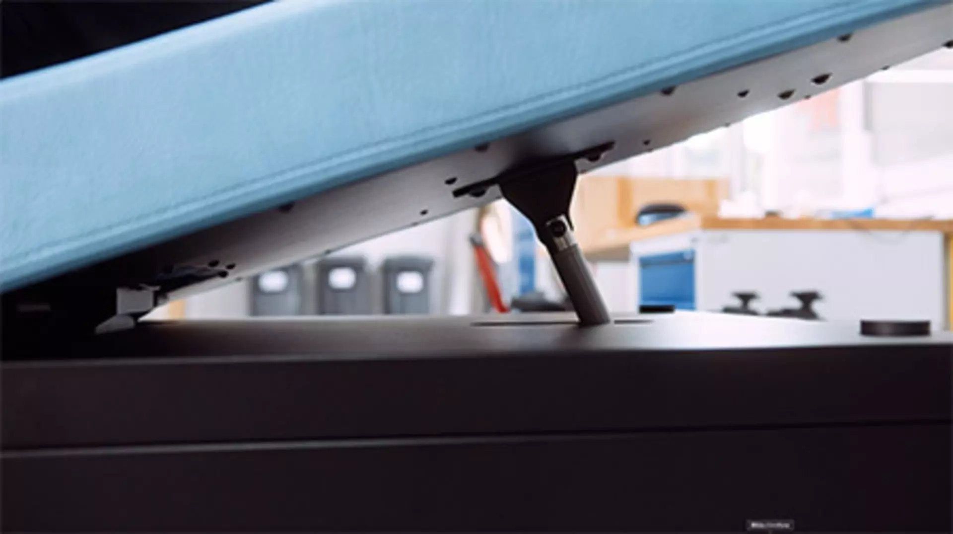  LINAK actuator seen in action raising blue head rest