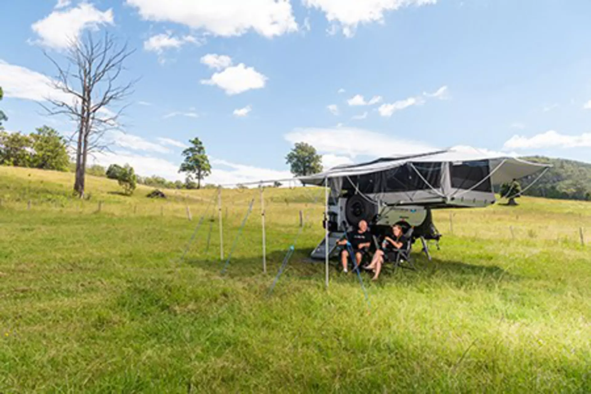 Couple camping with Ultimate's 25 X camper trailer