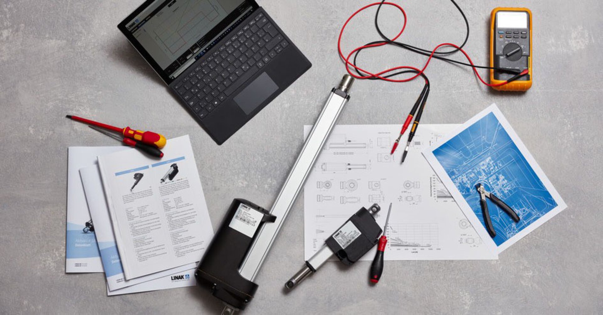 Two linear actuators with necessary tools and technical datasheets