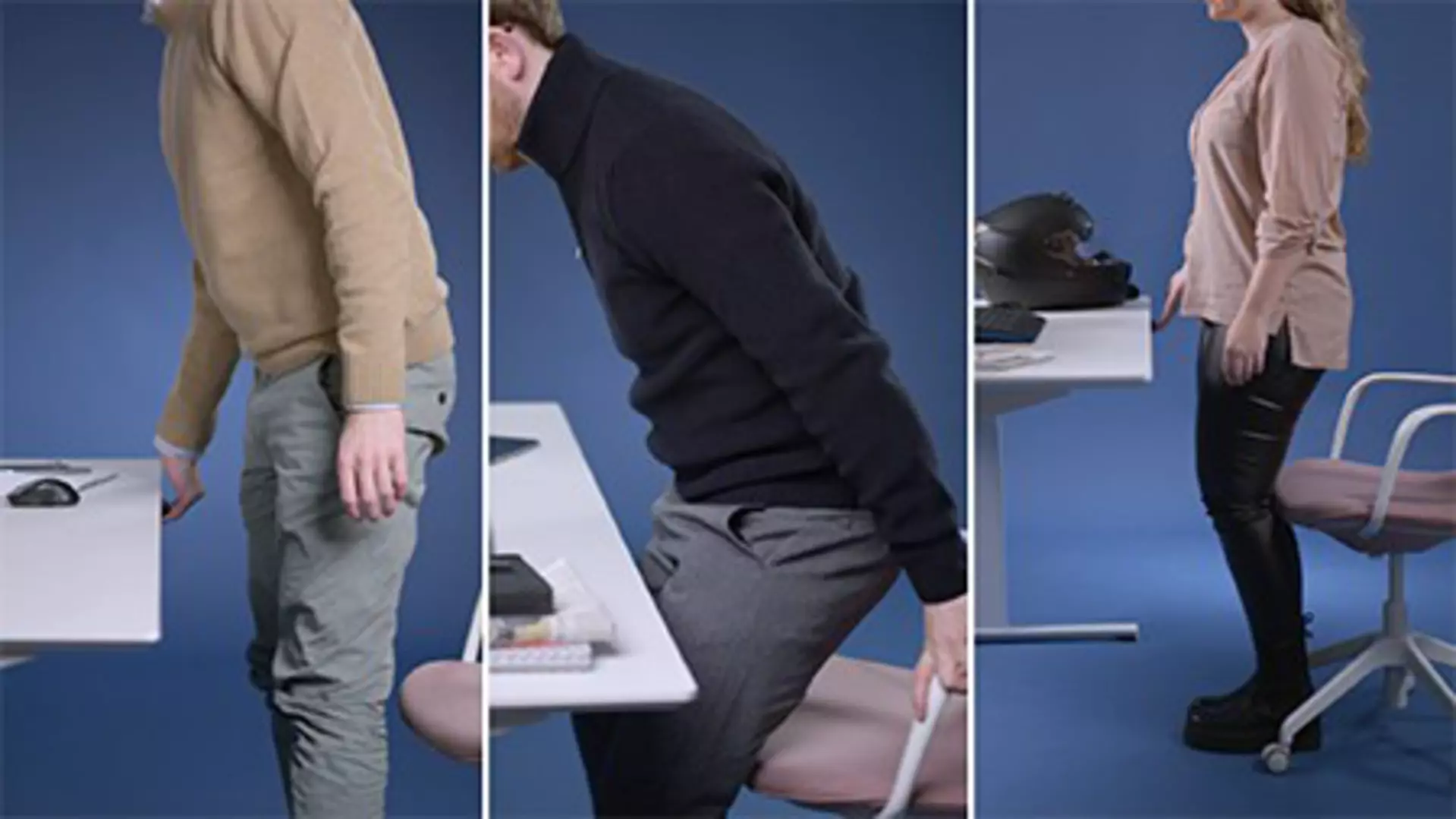Office workers changing from sitting to standing position at height-adjustable desk powered by LINAK