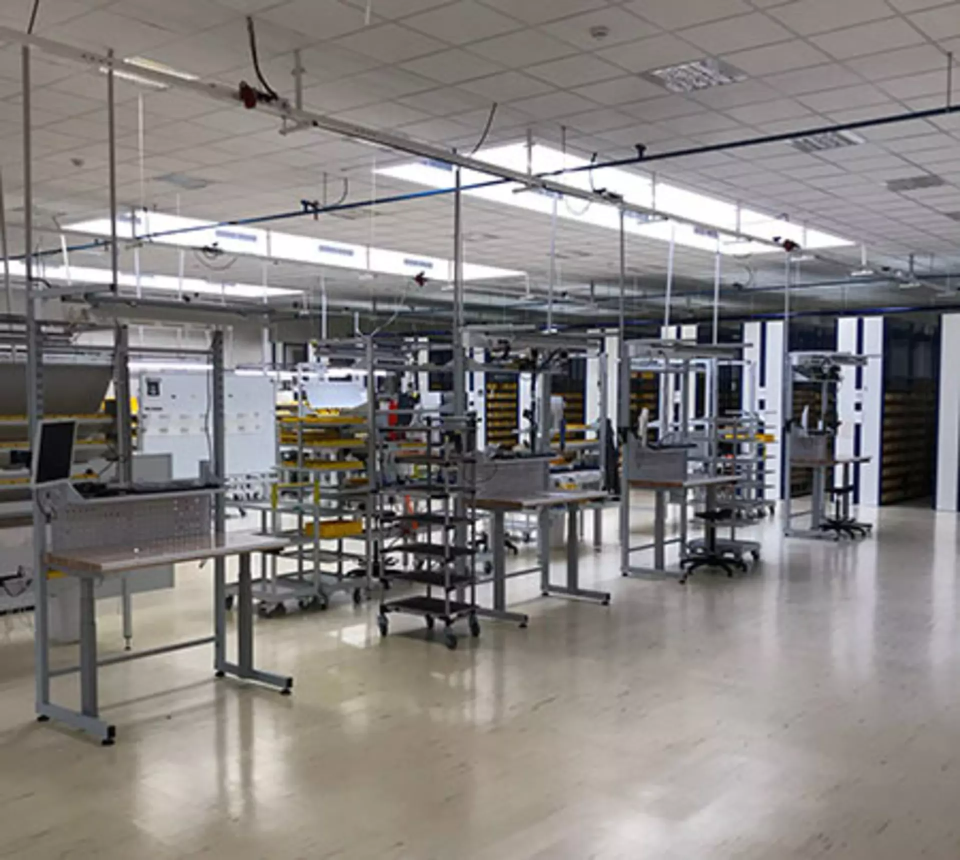 Height adjustable work stations in assembly factory